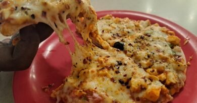 A delicious, freshly baked paneer pizza with an incredible cheese pull