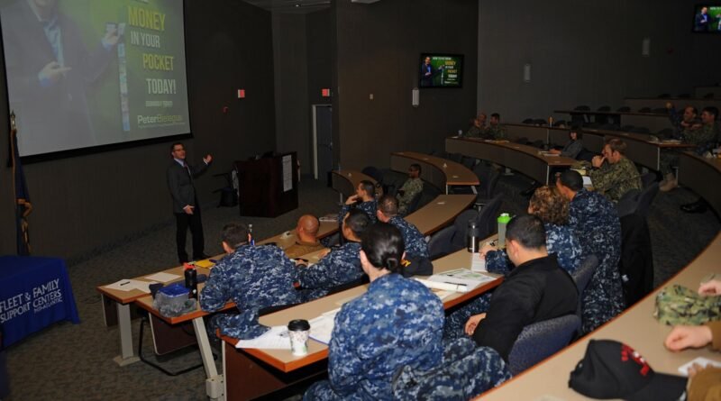Peter Bielagus, a motivational financial educator, speaks to Sailors during a command leadership forum event in support of Military Saves week at Join
