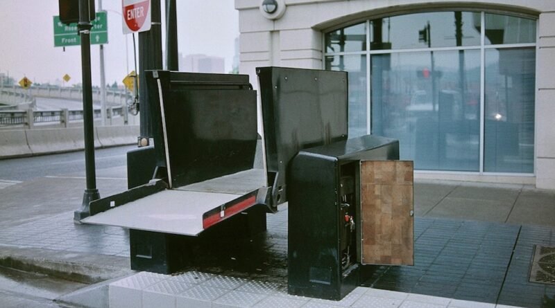One of the former wayside wheelchair lifts of the MAX Light Rail system in Portland, Oregon, undergoing maintenance – with the lift platform raised an